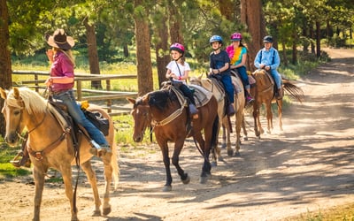 4 people horseback riding