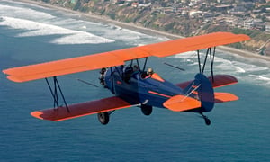 Biplane orange and blue over sarasota