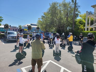 Group of Segways meeting in a parking lot in Naples