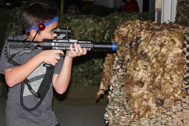 Kid playing laser tag in Sarasota