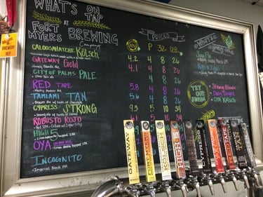 List of beers on a black board in Fort Myers Brewing Company