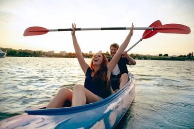 Man and women having a blast on a kayak