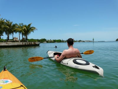 Man in a white kayak on Long Boat Key