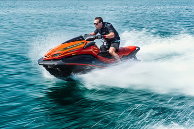 Man riding a orange jet ski