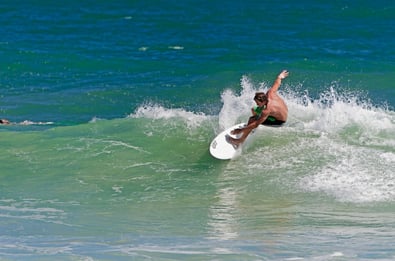 Man surfing on Venice Beach in Florida