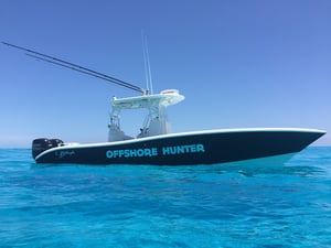 Offshore Hunter Fishing boat on crystal clear water