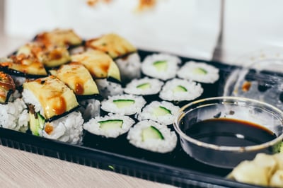 two different kinds of sushi with soy sauce