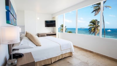 beautiful hotel room looking over the ocean