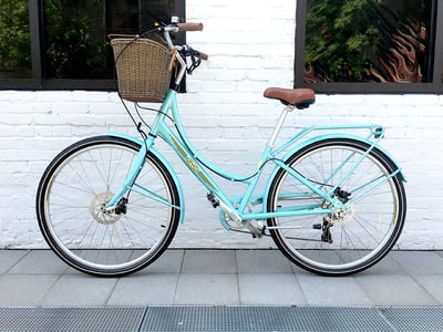 bright blue bike with a basket