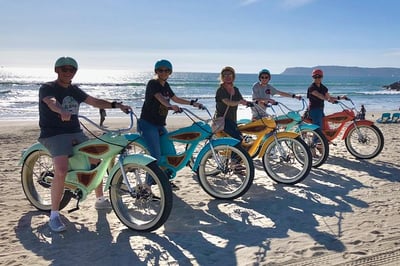 bright colored electric bikes on the beach