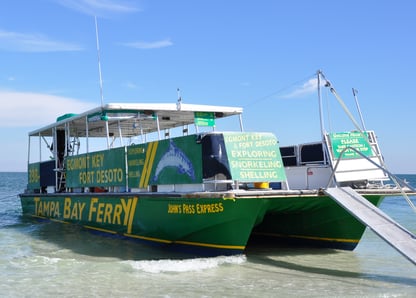 Green and yellow pontoon boat