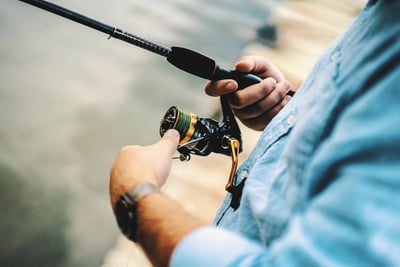 man fishing on his boat