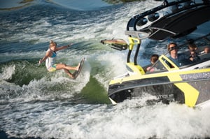 girl wake surfing on a lake