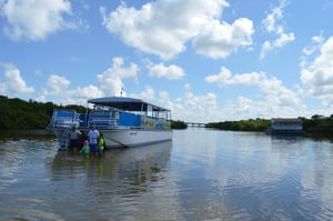 large pontoon boat in water in fort myers