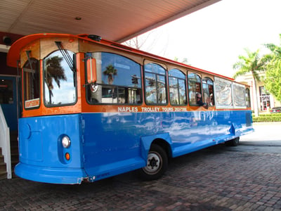 orange and blue bus for trolly tours around naples