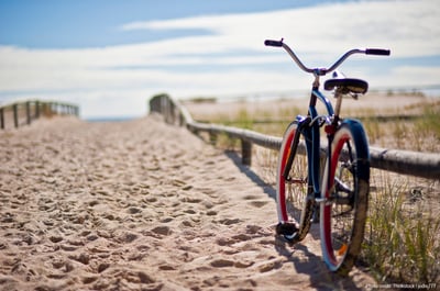 red and black bike on the beach in cape cod