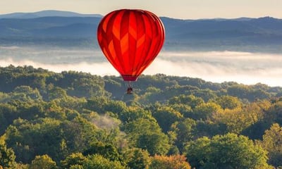 red hot air balloon in the sky