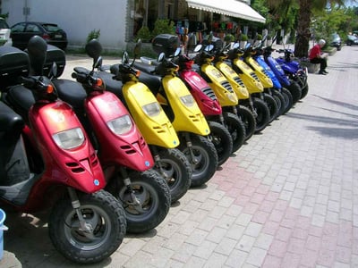 red, yellow and blue scooter on cape cod