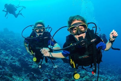 three people scuba diving-1