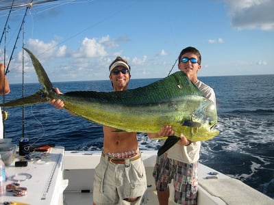 two men holding up a fish