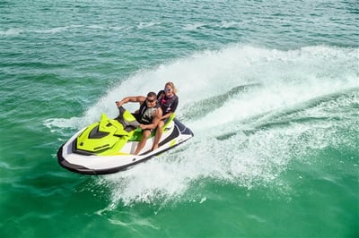 yellow jet ski with 2 people on it