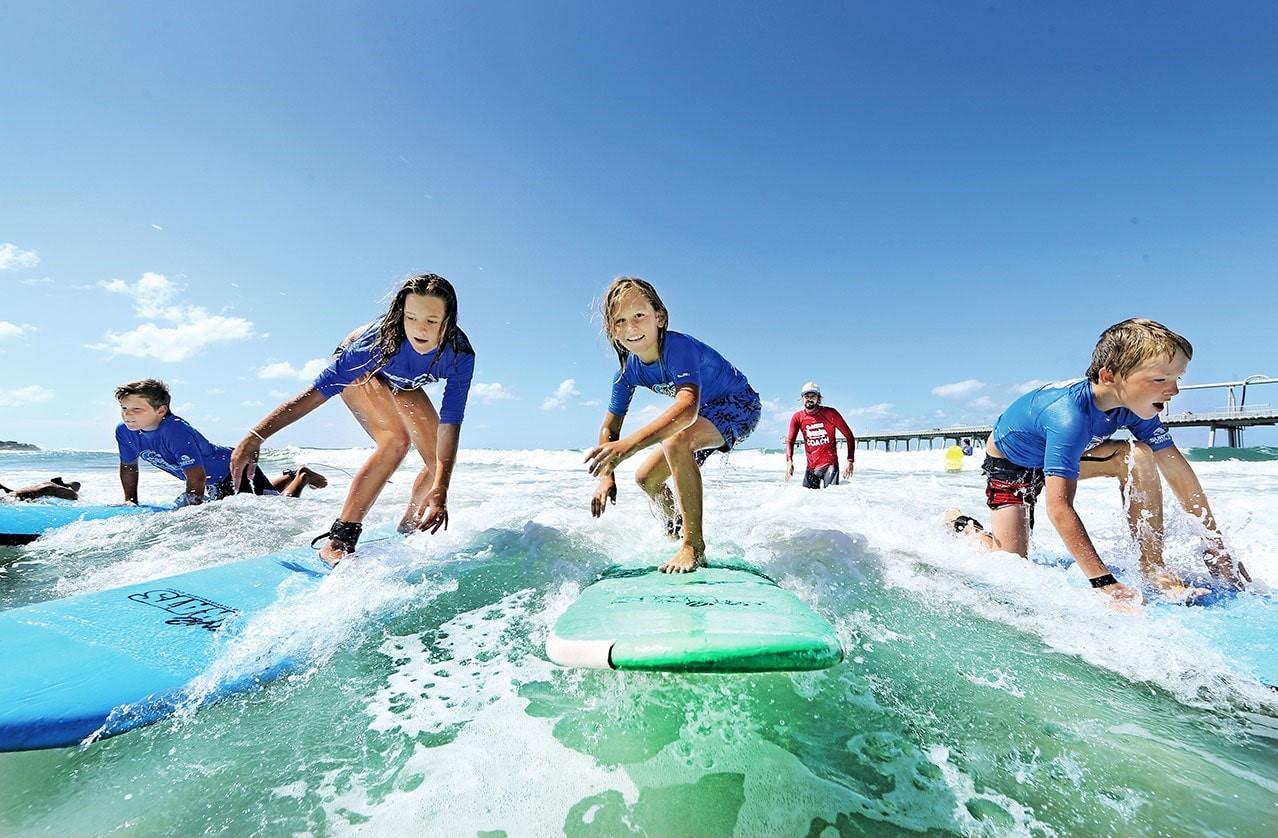 4 kids in a surf lesson in Tampa