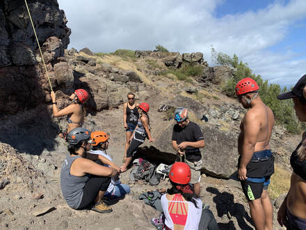 seven people rock climbing in Oahu