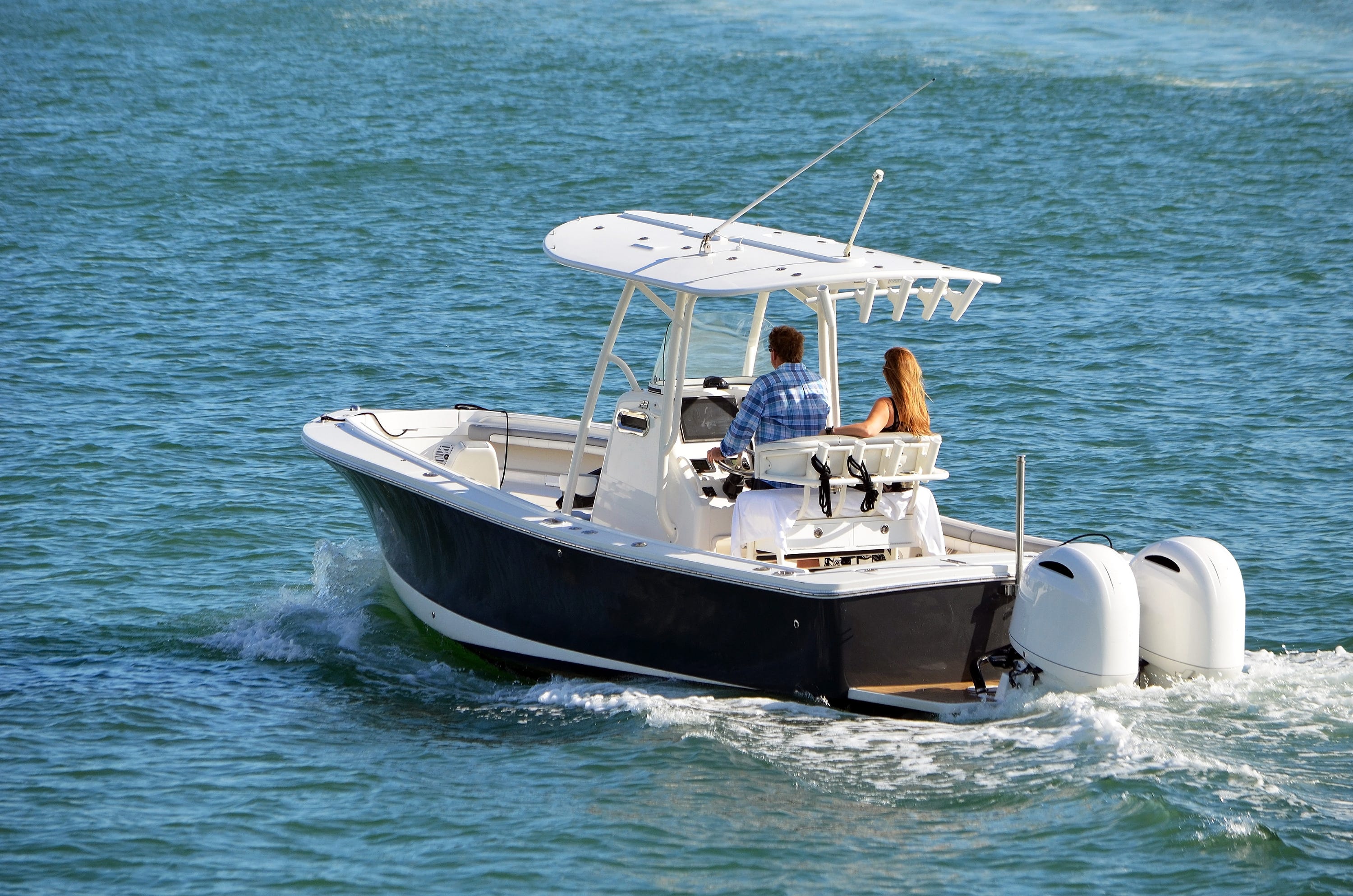 Couple taking a fishing boat out to sea in Florida