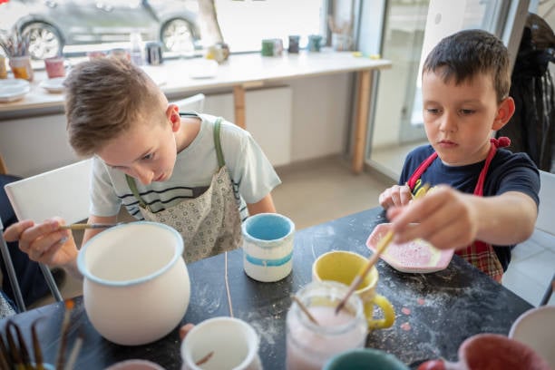 Kids painting pottery in Sarasota