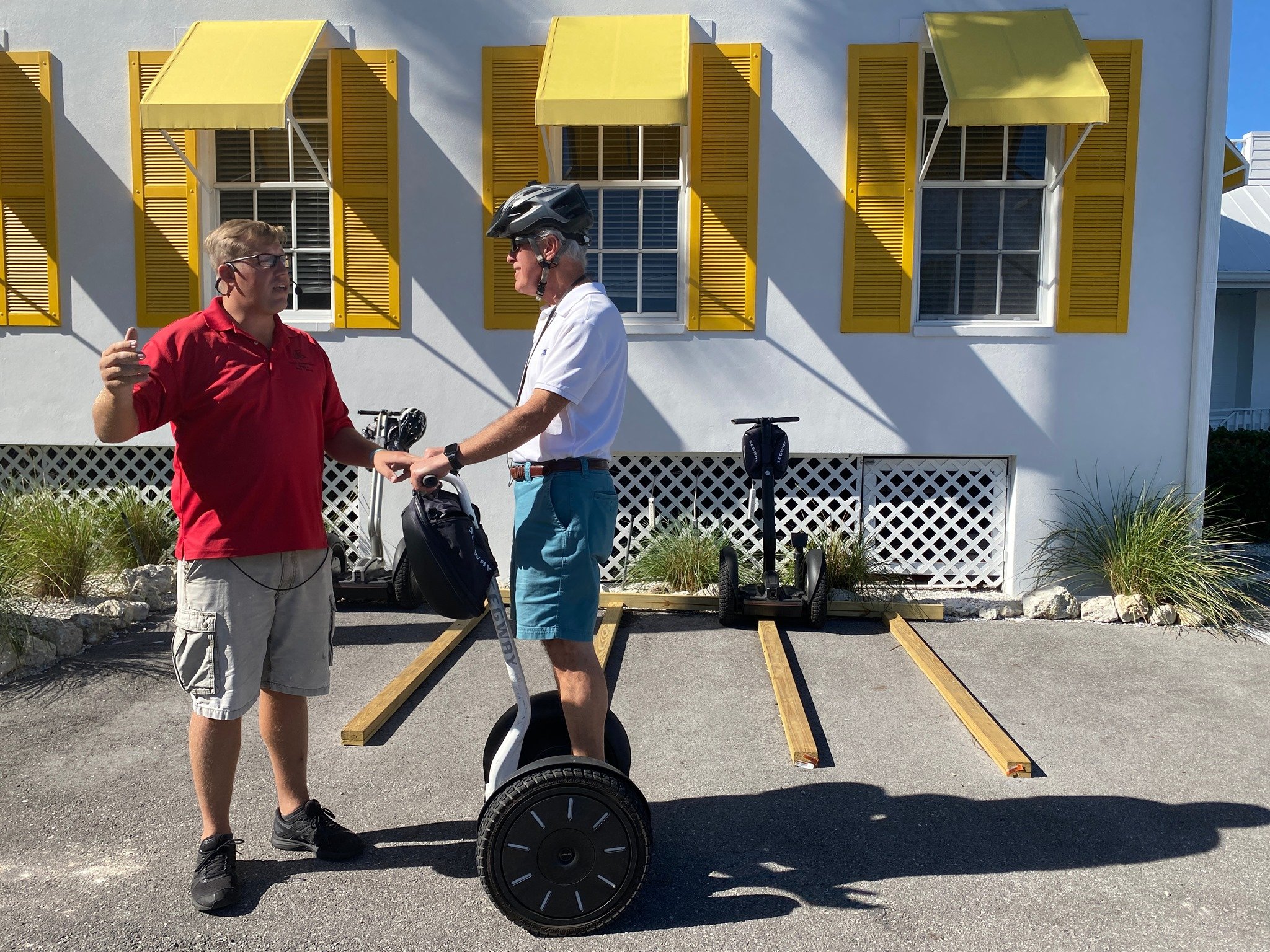 Older man learning how to ride a Segway