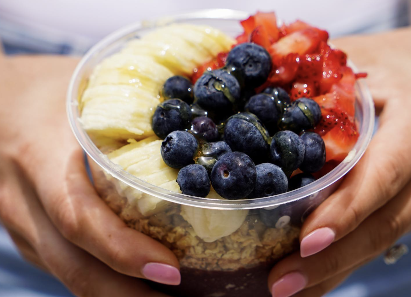 Lady holding a smoothie bowl