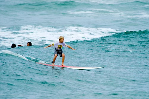 Young Boy Surfing on Kauai