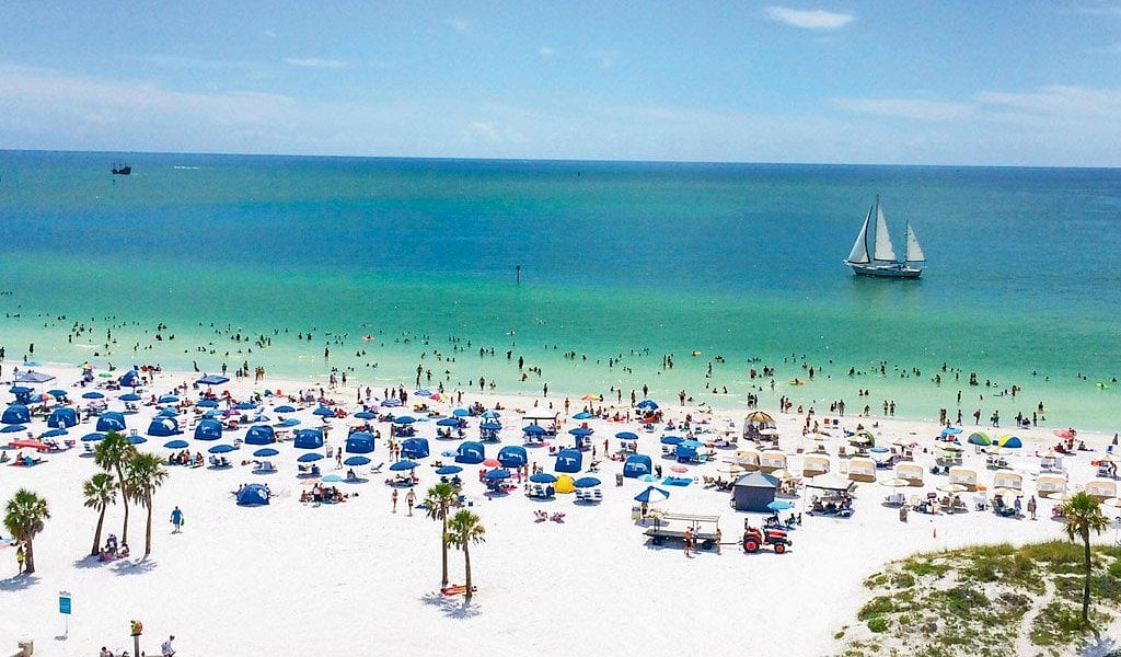 Sandy St. Pete Beach with blue beach chairs