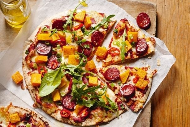 gourmet pizza with pizza, pineapple, lettuce, and pepperoni