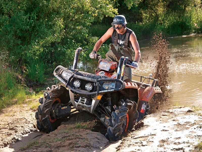 man on an ATV in the mud