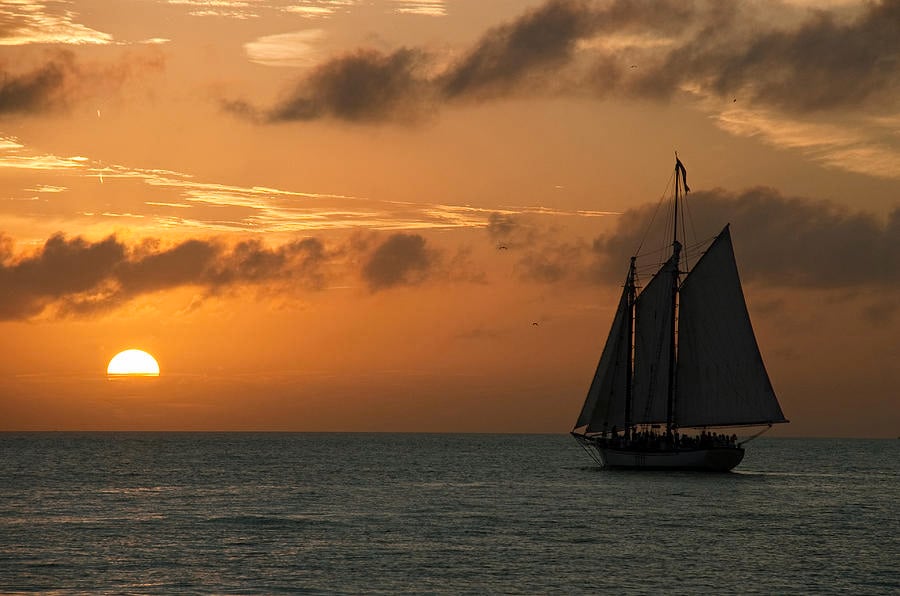 Sail boat sailing into the sunset