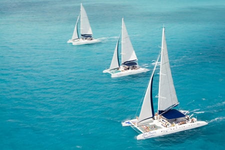 three sail boats in playa del carmen Mexico