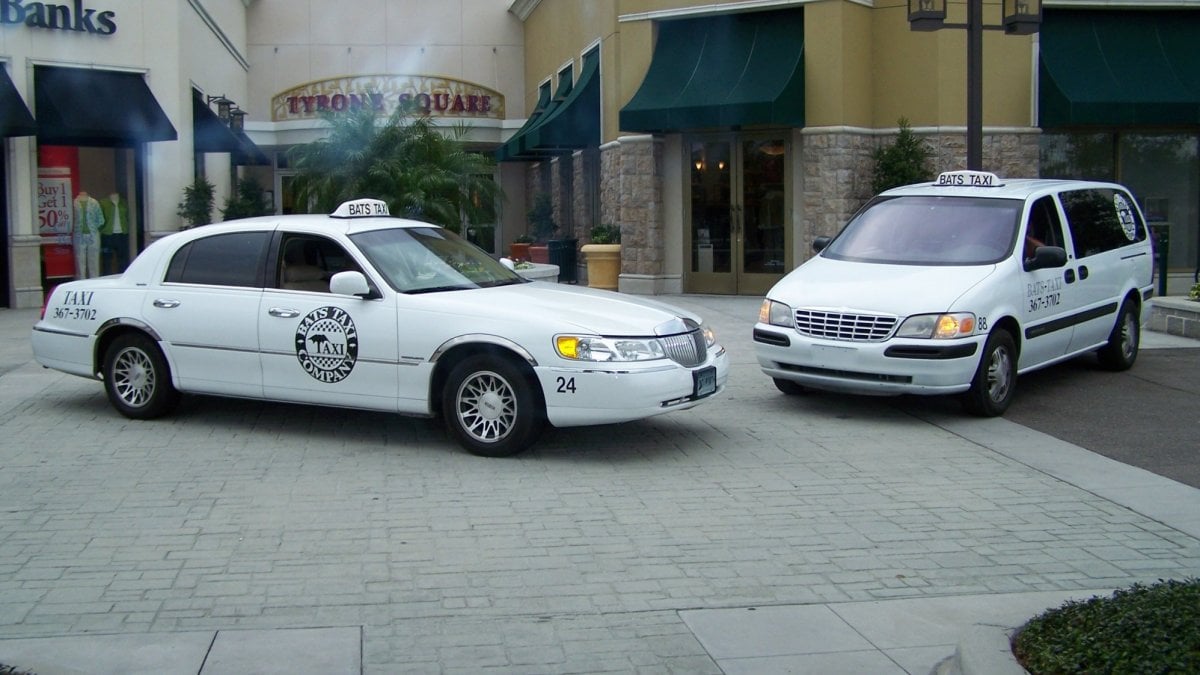 Two white taxis on St Pete Beach